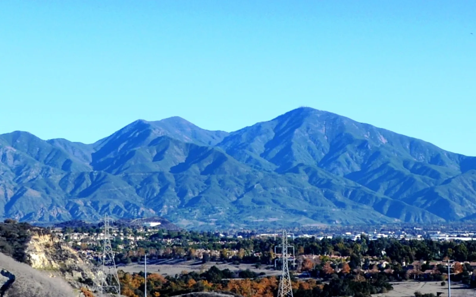 Panoramic landscape view of Saddleback Mountain with distinctive saddle-shaped peaks